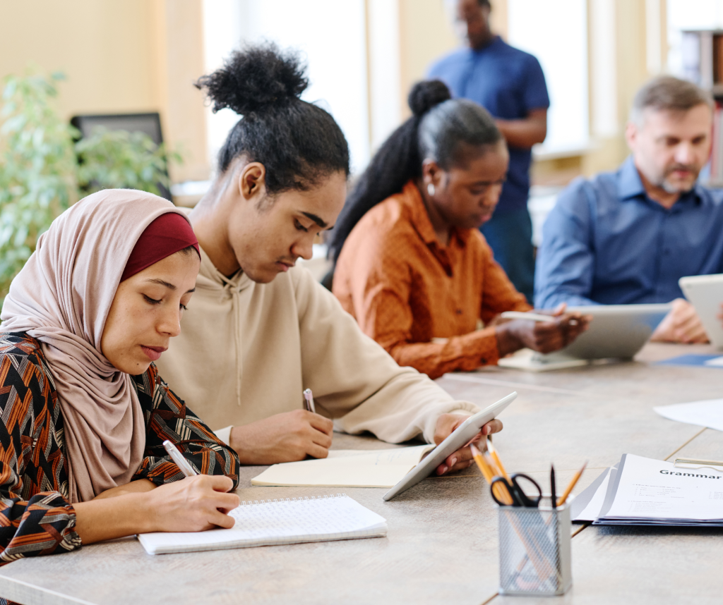 Culturally and linguitically diverse people writing and working